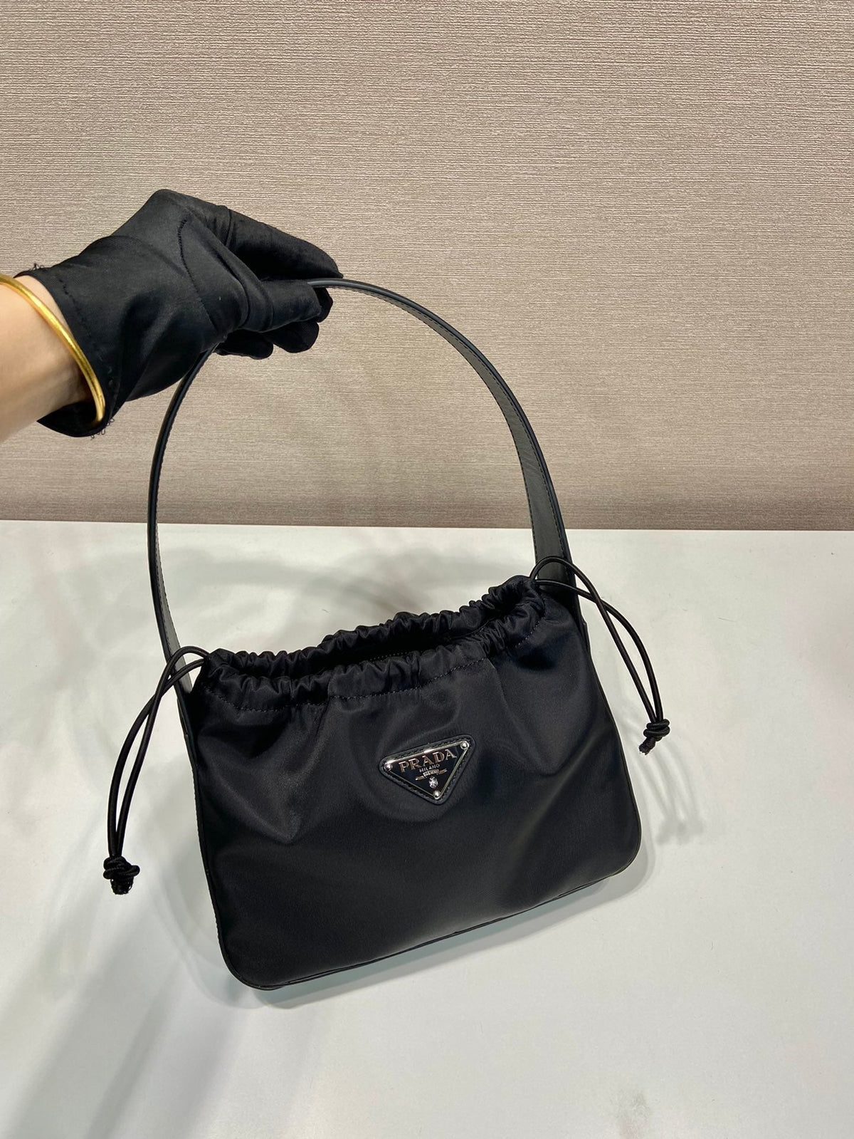 PRADA SMALL DRAWSTRING BAG 23 IN BLACK RE-NYLON
